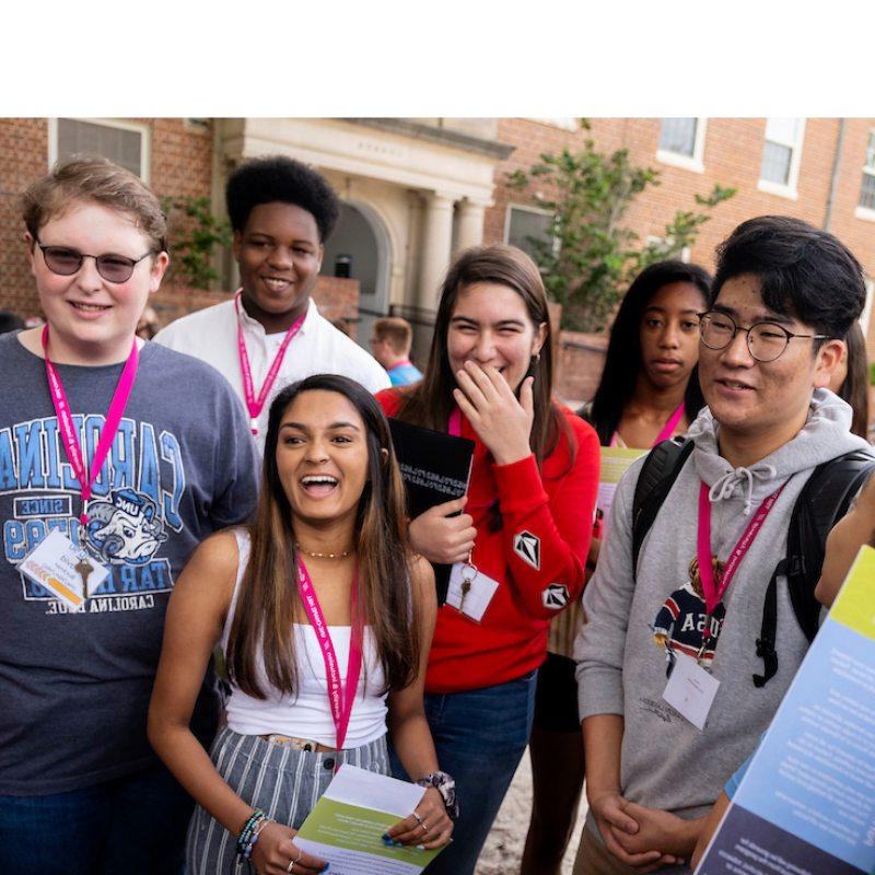 Students stand in a group during a tour.